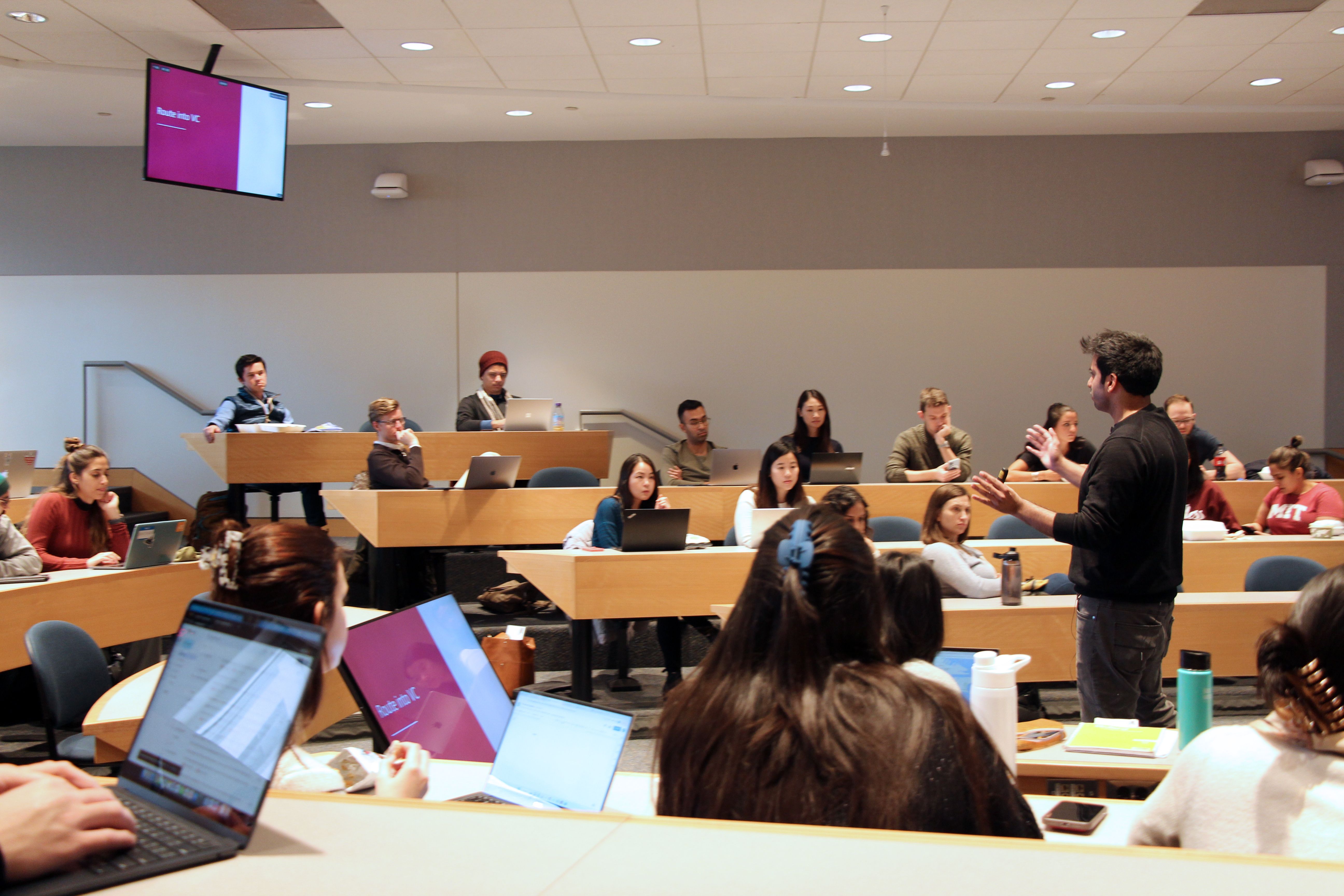 Hassan Akram addressing MBA students at MIT Sloan